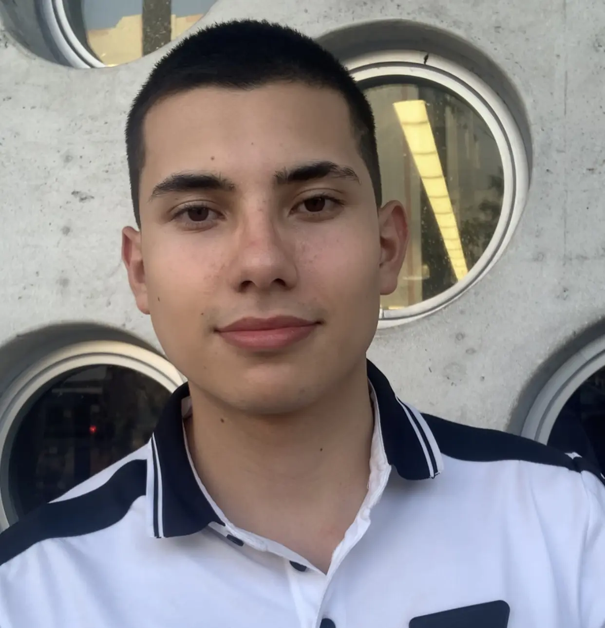 Andres Bonilla in a Tesla roadster